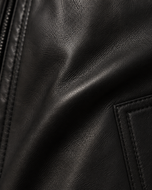 Wayne — men's black sheepskin leather jacket, close-up of the leather grain and hardware | Kordovan Pakistan