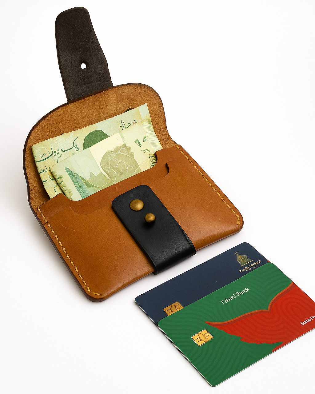 Brown leather wallet with money and cards on a white background