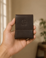 Seamless stitch-less wallet held in hand, card-sized profile