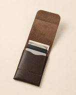 The Seamless wallet open — single compartment holding cards and cash