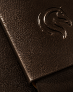 Close-up of the seamless single-piece brown leather construction