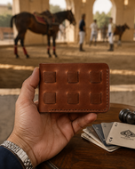 Brown Stallion woven full-grain leather wallet held in hand