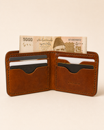 The Stallion wallet open — multiple card slots in full-grain leather