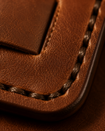 Close-up of the handwoven full-grain brown leather on the Stallion wallet