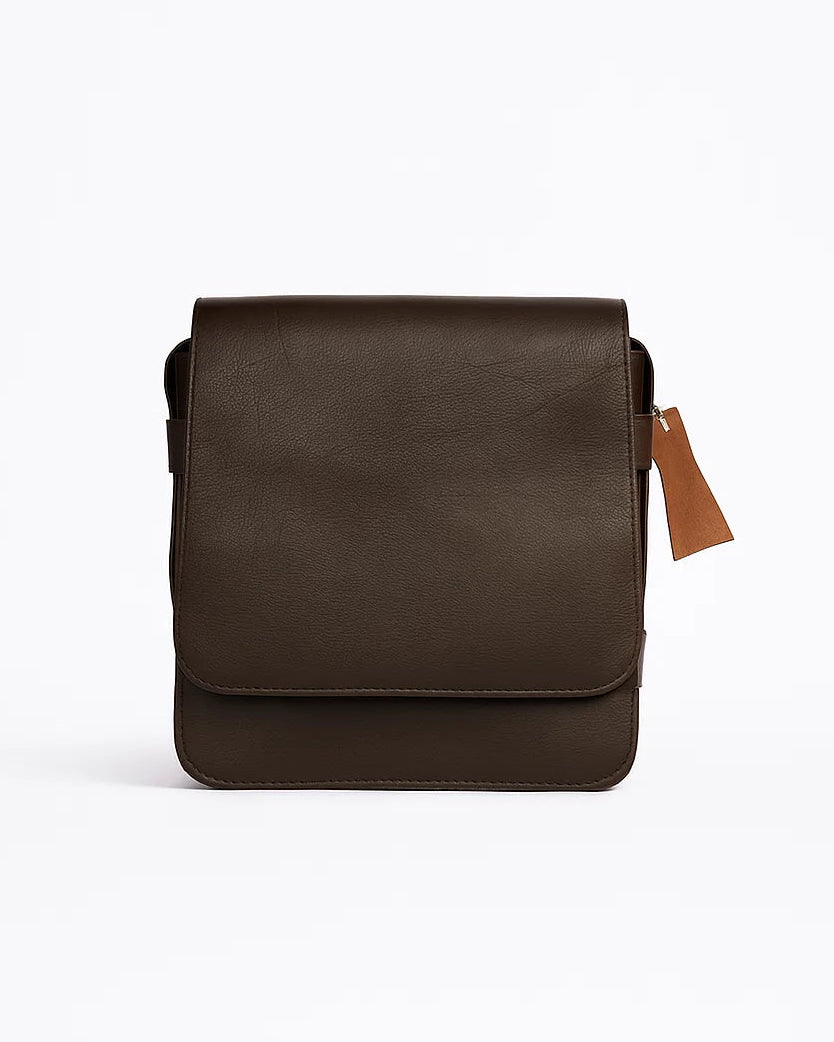 Brown leather crossbody bag on a white background