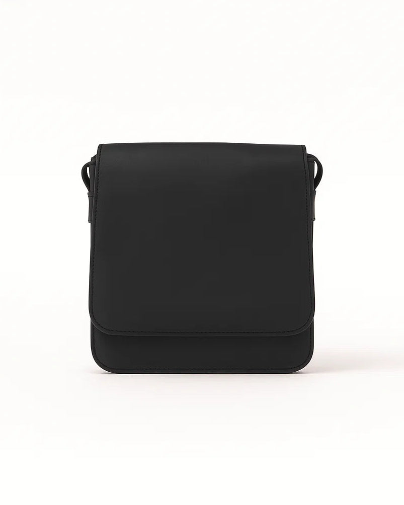 Black crossbody bag on a white background