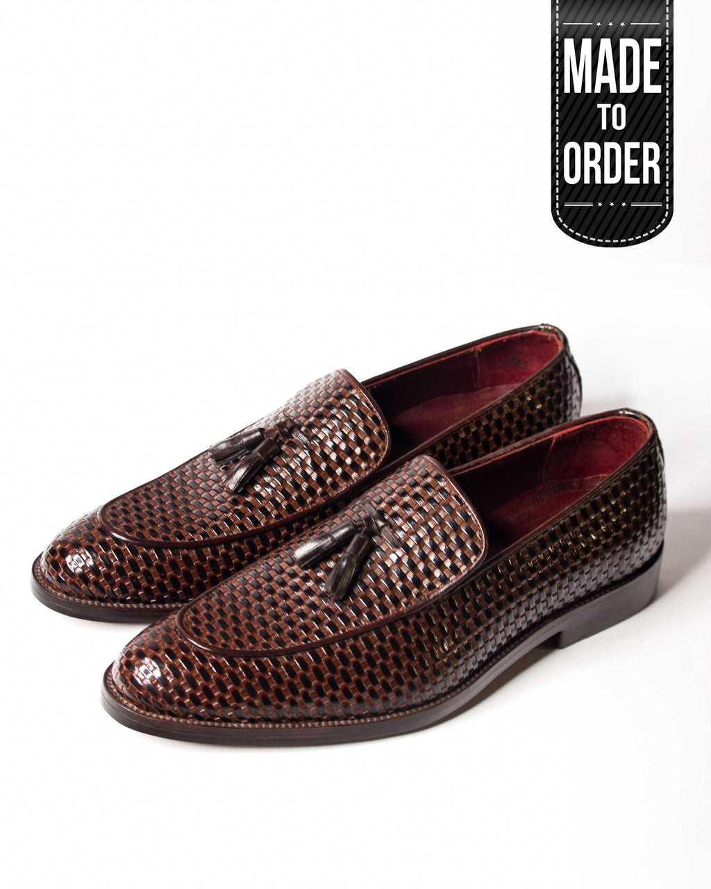 A pair of brown woven leather loafers with a label that reads 'Made to Order'.